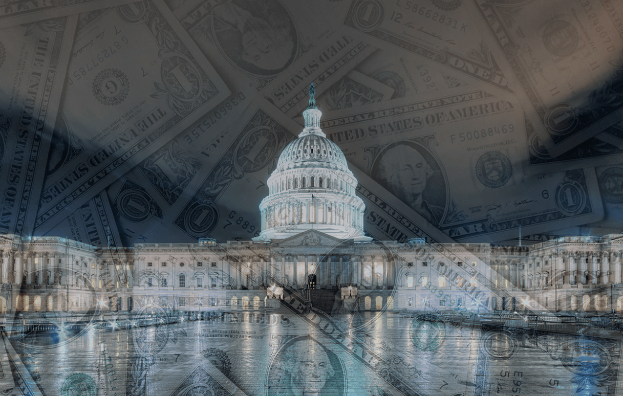 Photograph of the U.S. Capitol building at night overlaid with transparent images of the U.S. $1 bill. 