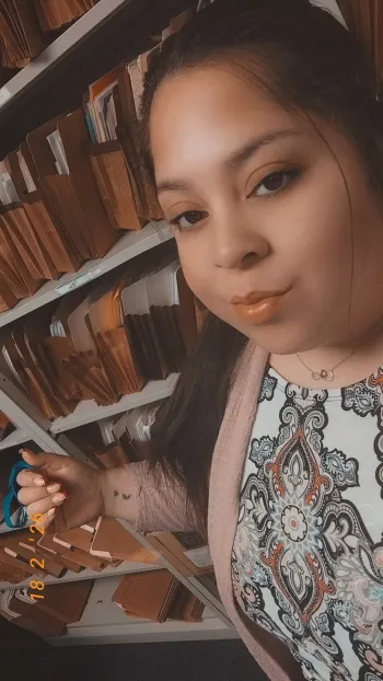 Shakira in front of office files
